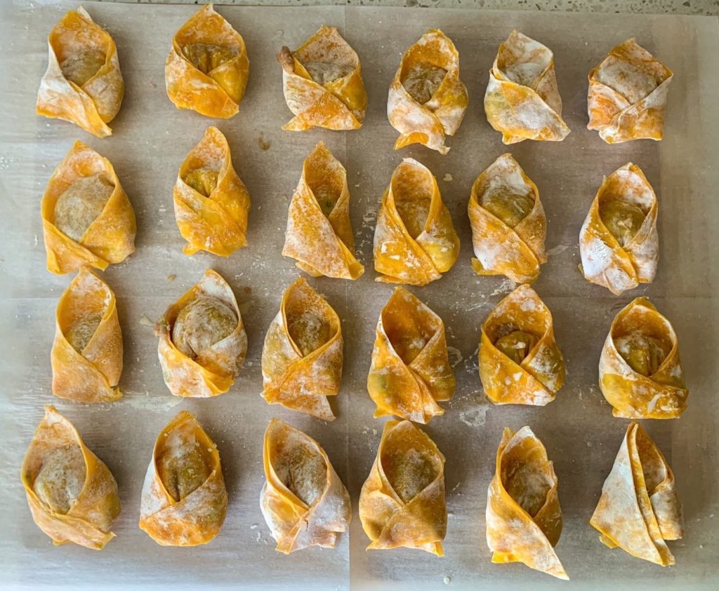 uncooked wontons on a table