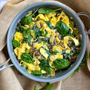 creamy fettuccine with mushrooms and thyme aerial view