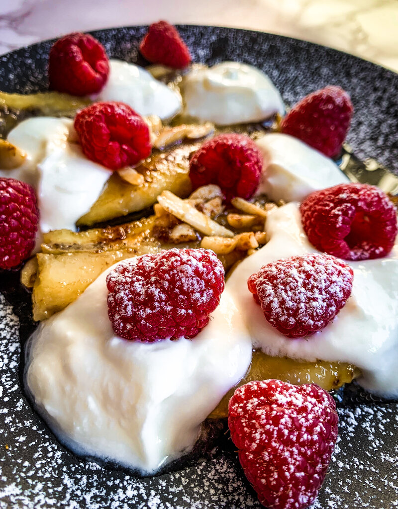 caramelized bananas with raspberries side view