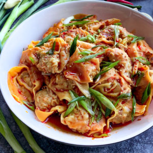 spicy wontons in chili scallion oil recipe image