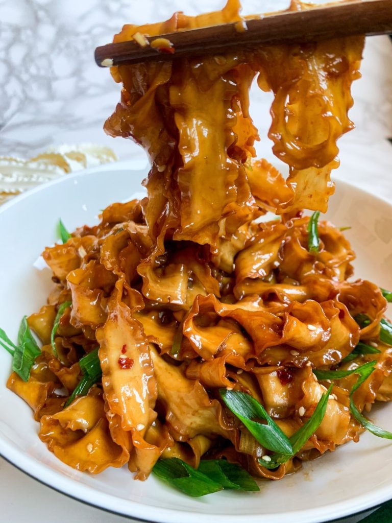 soy garlic noodles on a plate front view