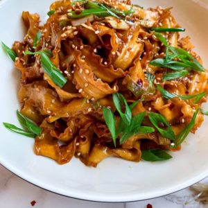 soy garlic noodles on a plate side shot