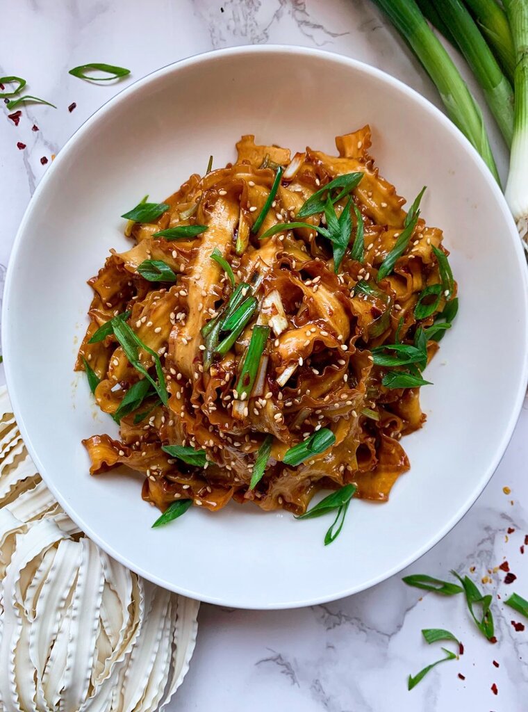 Soy garlic noodles on a plate aerial shot.