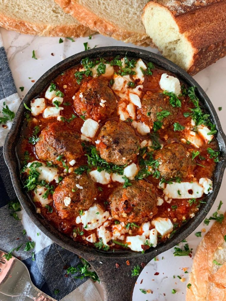 Shakshuka with lamb meatballs in a cast iron skillet