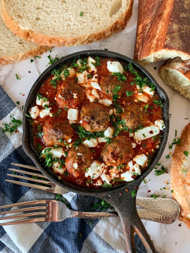 shakshuka meatballs with bread, feta and parsley