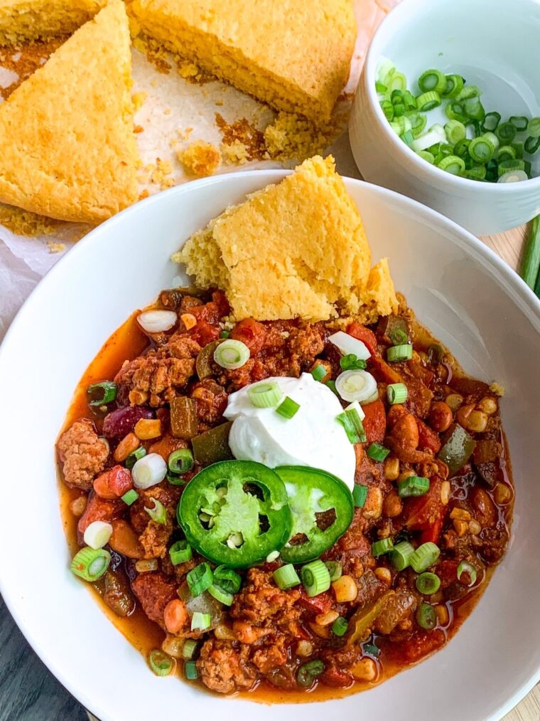 Bowl of 30 minute spicy chili with cornbread