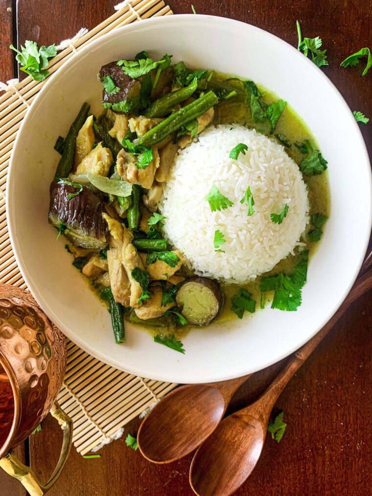 Thai green curry with chicken, eggplant and oyster mushrooms in a bowl