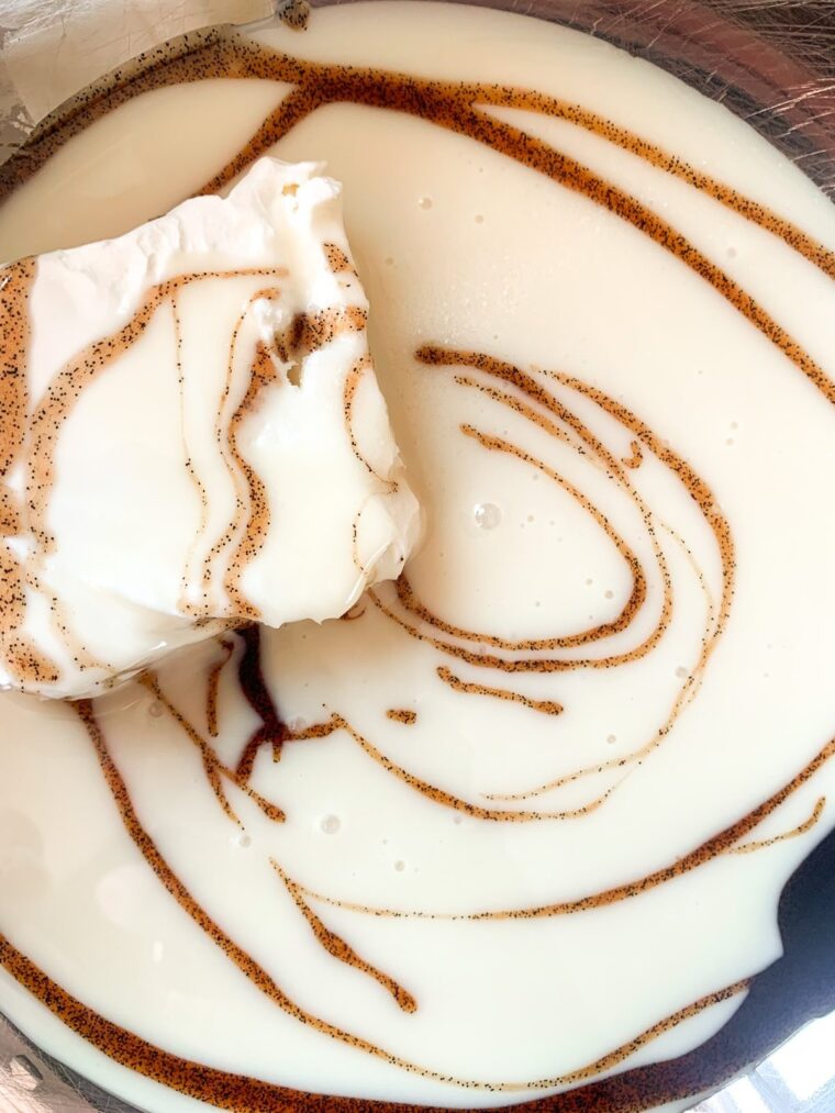 close up shot of cream cheese and vanilla bean paste