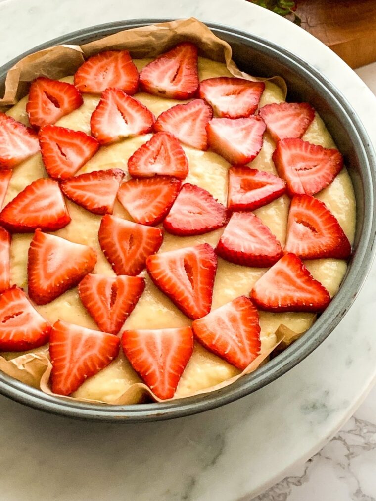 strawberries on top of cake batter