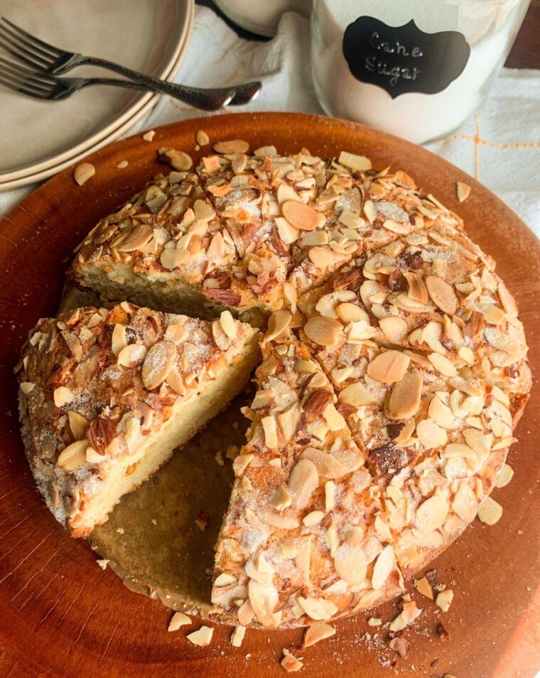 greek yogurt almond cake topped with flaked almonds