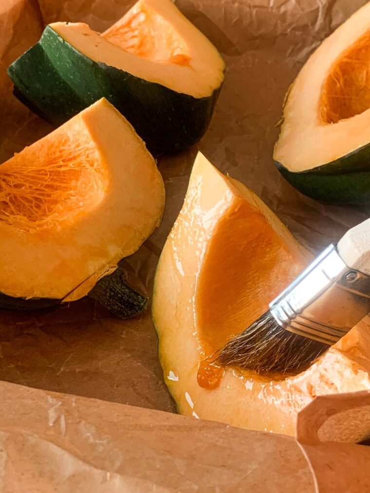 acorn squash pieces on roasting pan
