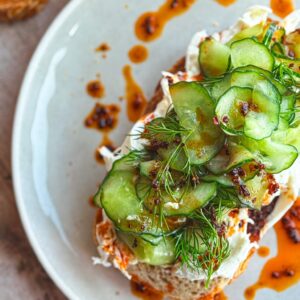 cucumber lox toast with burrata and Turkish chili oil