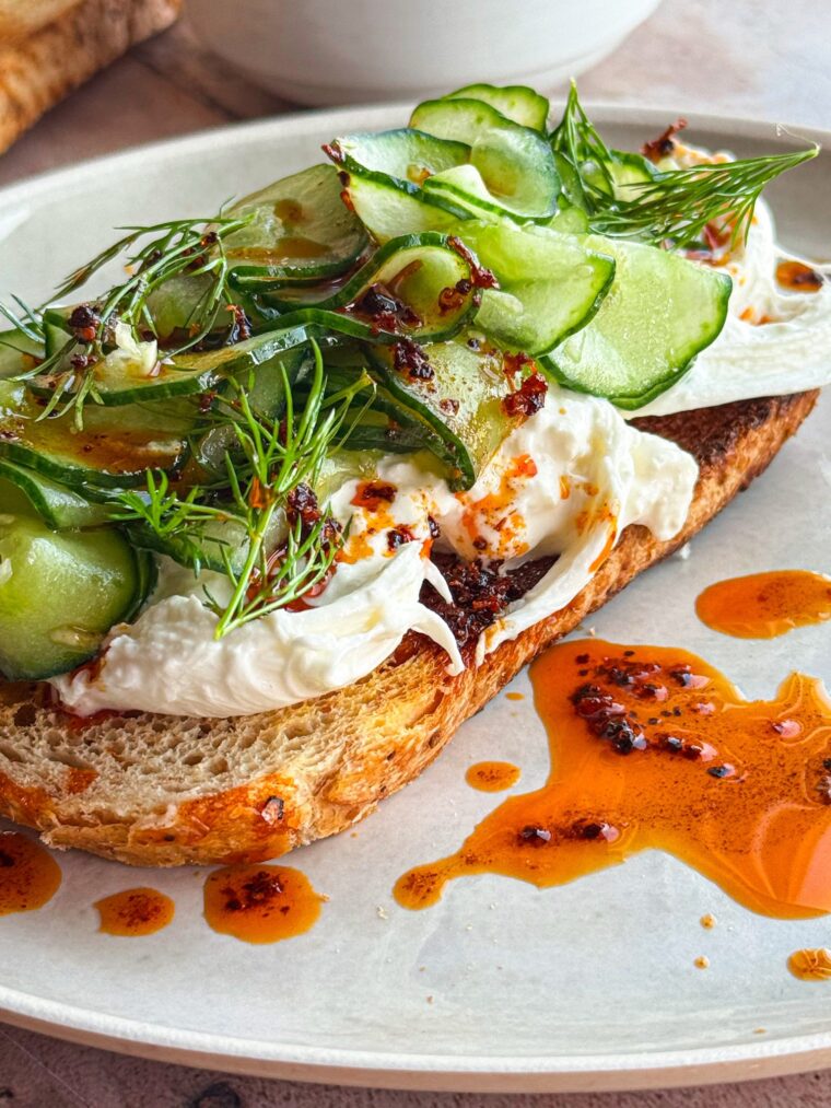 finely sliced cucumber with burrata cheese on toast